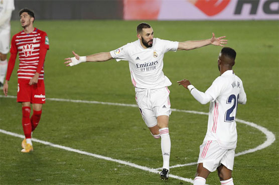 Real ease past Granada to join Atletico at top of Liga