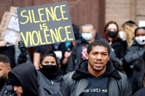 Heavyweight champion Joshua hits out at 'virus' of racism