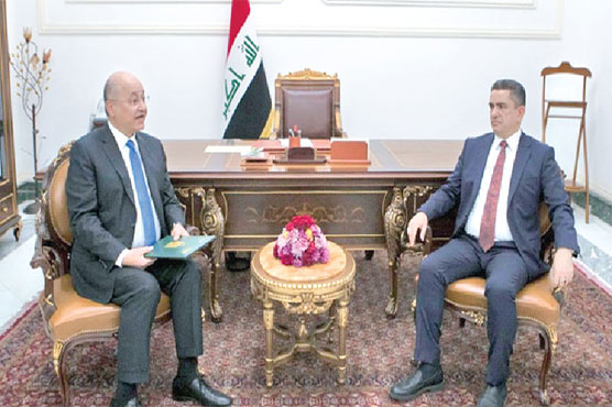 Iraq names new PM as rockets hit base hosting foreign troops