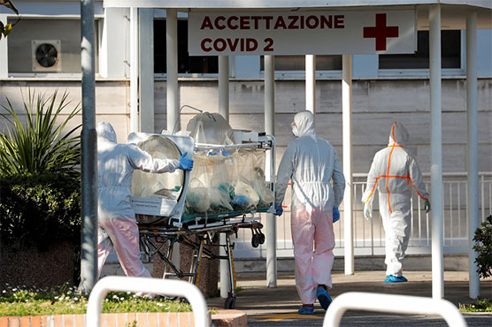 Italy virus deaths hit record as Trump goes on war footing