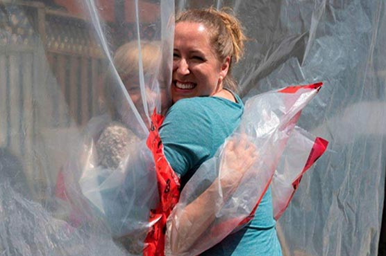 'Hug glove' gives Canada family bit of normalcy in pandemic