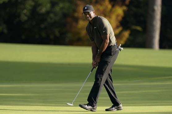 The Latest: Masters 1st round halted with 44 on the course