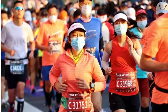 Shanghai marathon defies coronavirus with 9,000 runners