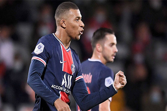 Tireless Mbappe sends PSG top with brace at Nimes