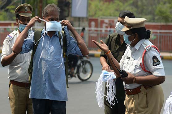 India imposes new curbs as Covid-19 cases hit record