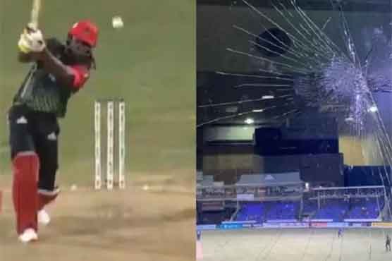 Gayle shatters window pane with a powerful six