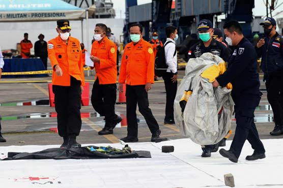 Body parts found at Indonesian plane crash site