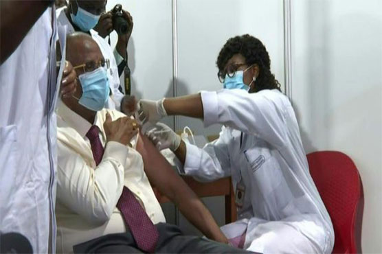 World's first Covax jab injected as US eyes J&J rollout