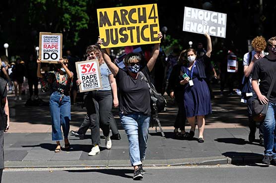 Black-clad women rally in Australia to demand gender violence justice