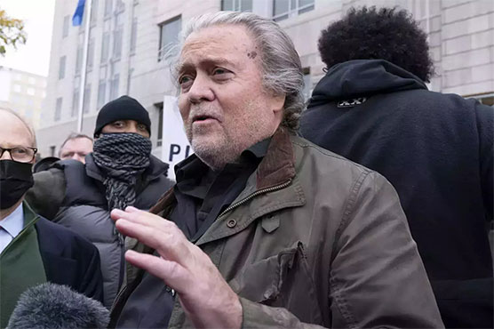 Trump ally Bannon surrenders to face Capitol riot probe charges