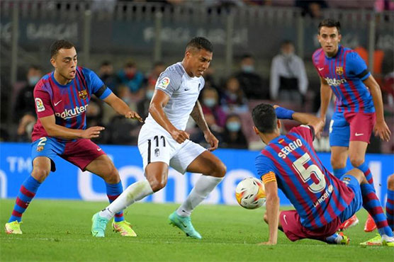 Barca scrape late draw with Granada as fans stay away