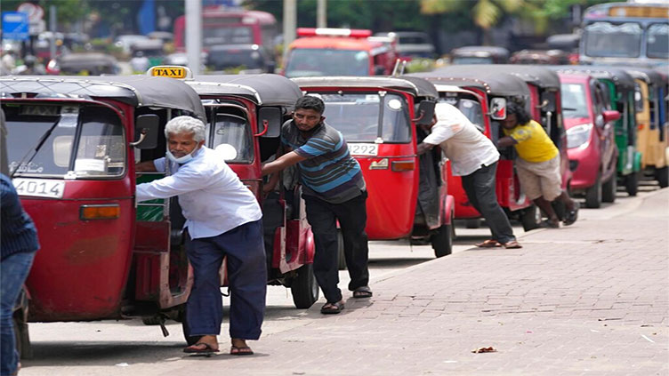 Bankrupt Sri Lanka rations fuel as crisis worsens