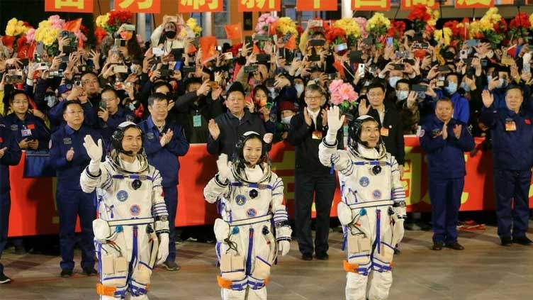 Three Chinese astronauts return to Earth after six months in space