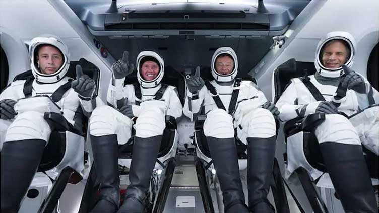 Crew of first private flight to ISS return to Earth