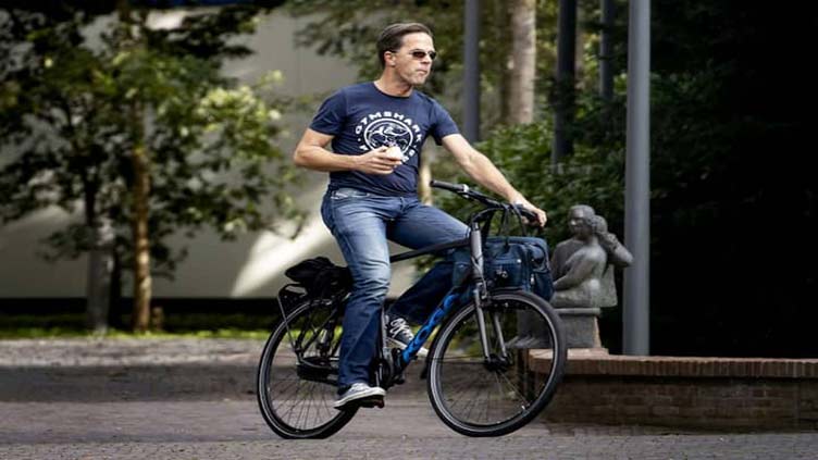 Bike-loving Rutte rides to record term as Dutch PM