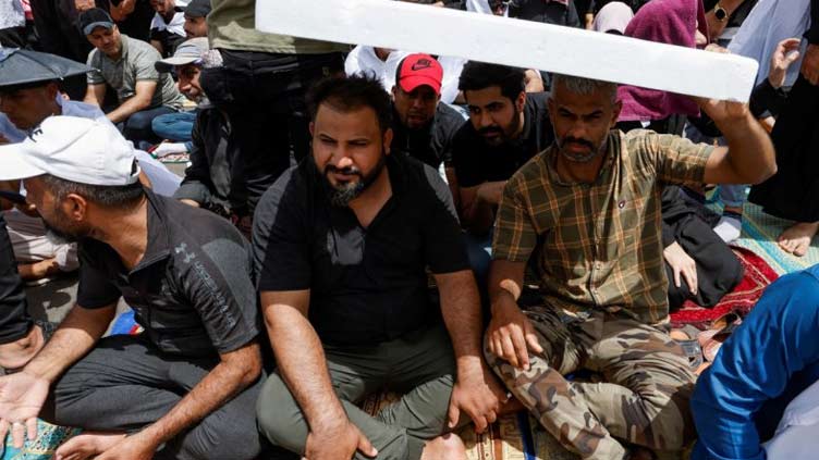 Sadr followers hold mass prayer outside Iraqi parliament in show of force