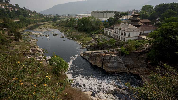  Nepal's holy Bagmati River choked with black sewage, trash