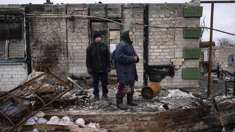Six months on, Ukraine fights war, faces painful aftermath
