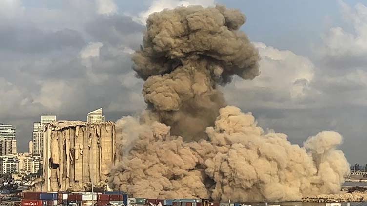 Large section of smoldering Beirut port silos collapses