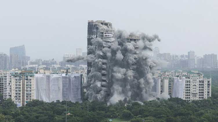 Plumes of dust as India demolishes illegal skyscrapers