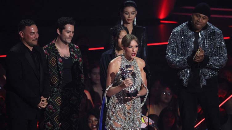 Taylor Swift wins top MTV video award, announces new album