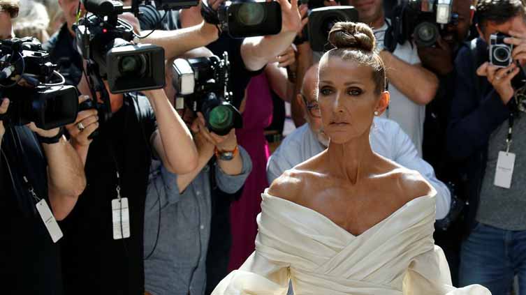 Celine Dion reveals she has rare neurological disorder, postpones shows