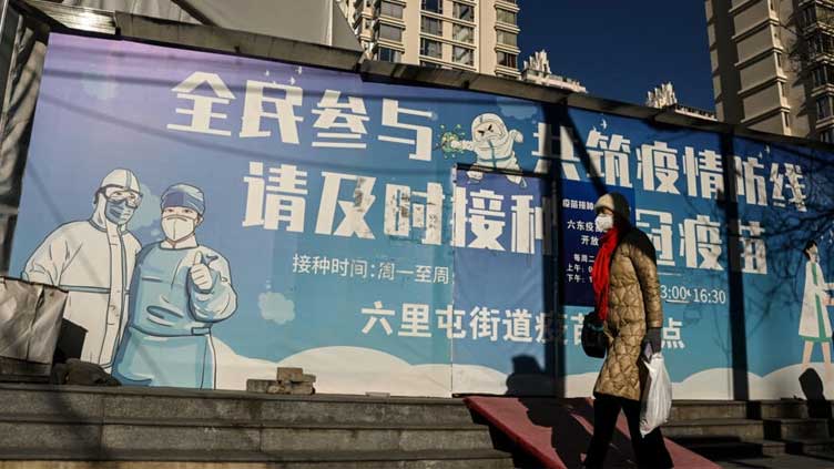  Top China expert says Covid 'spreading rapidly' after rules easing