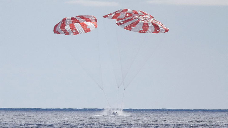 NASA’s Orion capsule returns to Earth after test flight to Moon