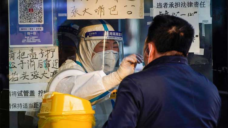 Queues at fever clinics as China wrestles with Covid surge