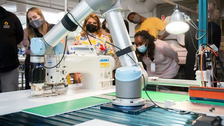  Robots set their sights on a new job, sewing blue jeans