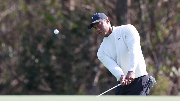 Woods and son Charlie seek title before Tiger rests sore foot