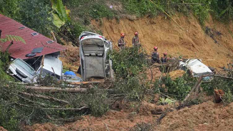 Search underway for 12 missing in Malaysia landslide