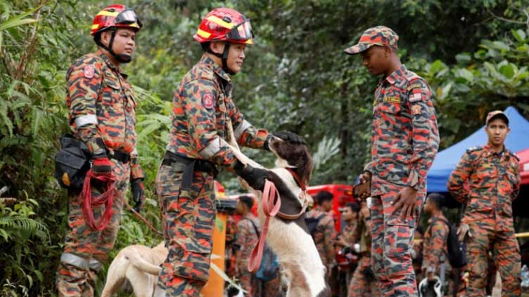  Malaysia police questions campsite operator after landslide kills 24