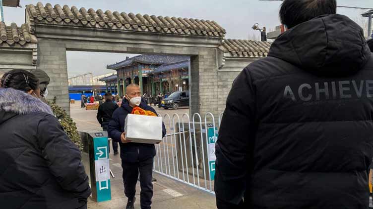 China's crematoriums 'packed' as Covid cases soar