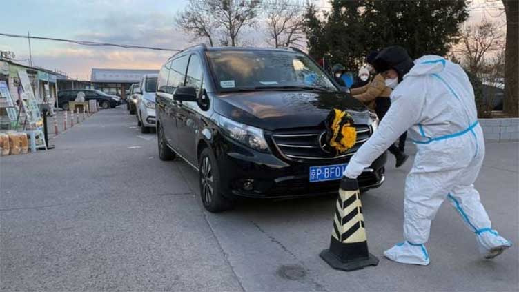 Hearses queue at Beijing crematorium, even as China reports no new COVID deaths