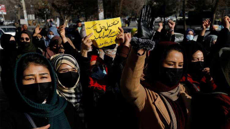  Dozens protest in Afghan capital after Taliban close universities to women