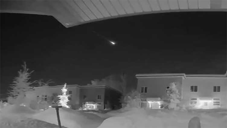 Fireball flashes in dark sky above Alaska