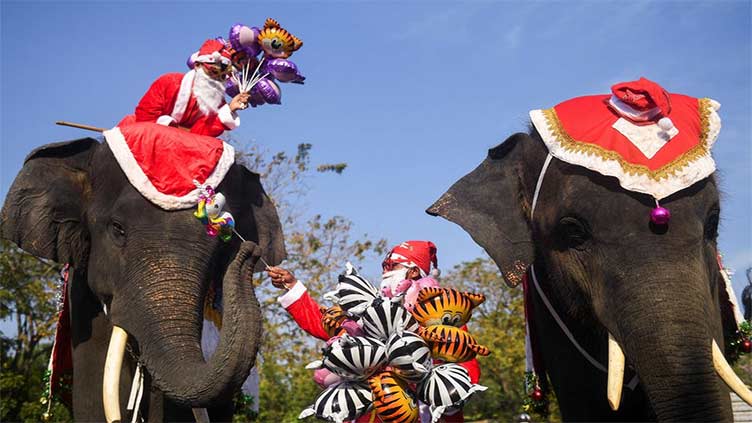 In Thailand, Santa delivers presents on elephants