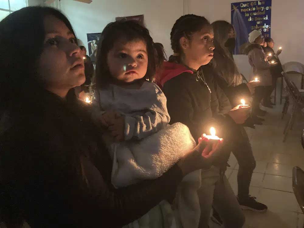 Stuck at the border, migrants find a little Christmas cheer