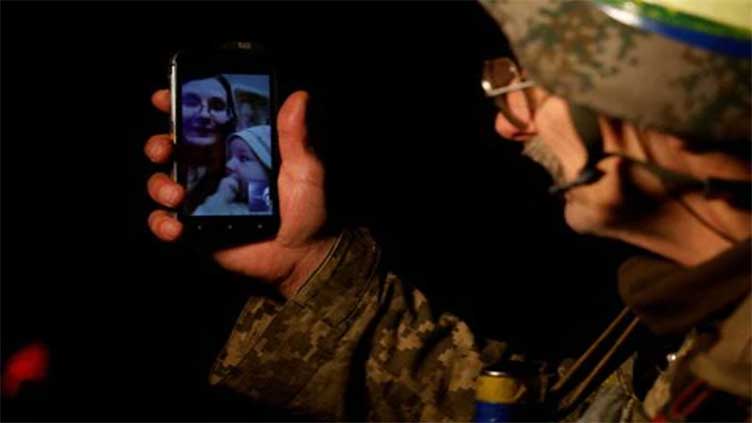 Ukrainian soldier reunites with family over Christmas call from east