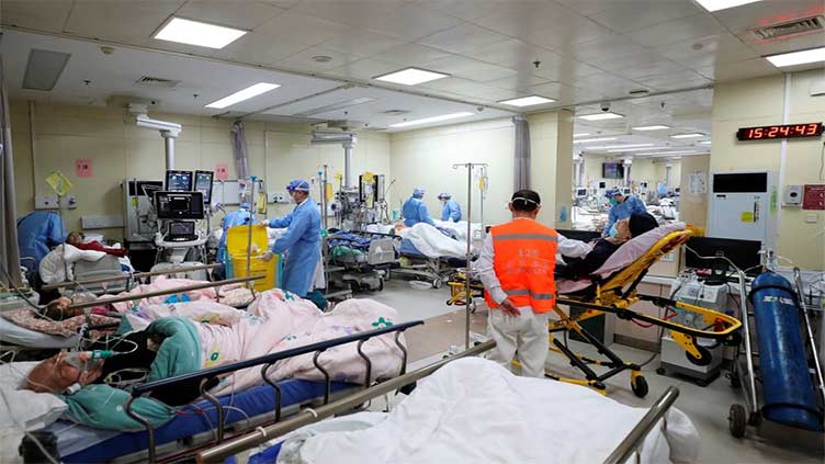 Chinese hospitals 'extremely busy' as Covid spreads unchecked