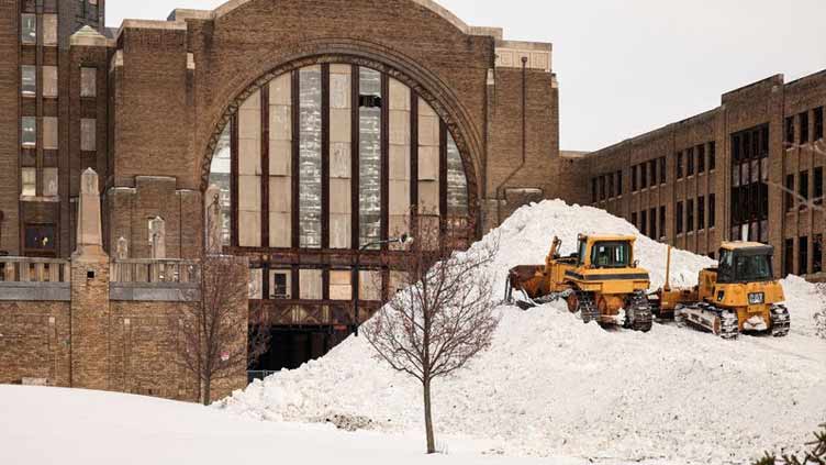 As thaw from US' deadly blizzard begins, troops check for more victims