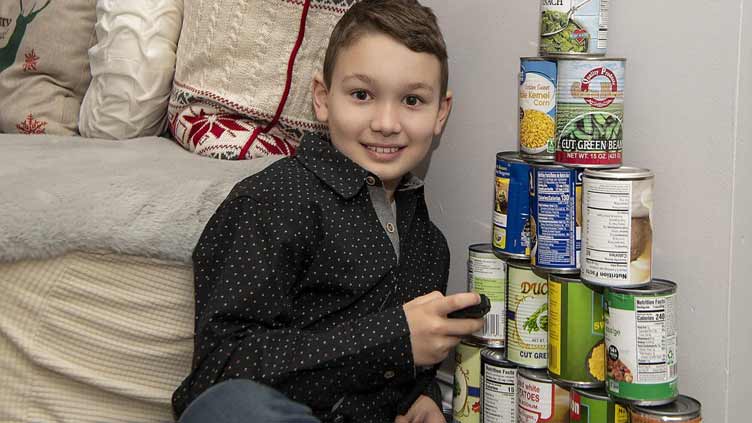Maryland fourth-grader breaks can stacking world record