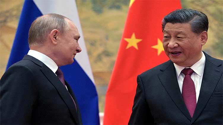 Putin expects China's Xi to visit in spring, wants to boost military cooperation