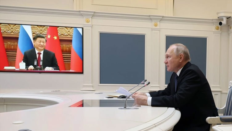 Putin tells Xi he wants to ramp up military cooperation