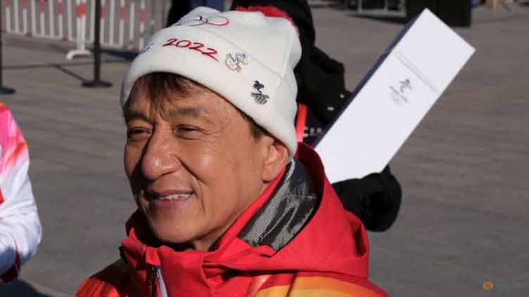 Actor Jackie Chan carries Olympic torch atop Great Wall