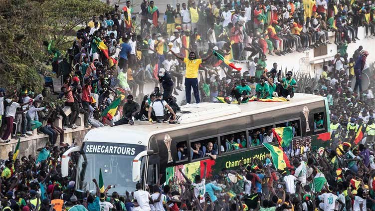 Ecstatic crowds greet victorious Senegal on Cup of Nations return