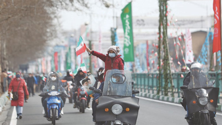 Iranians get behind wheel to mark Islamic revolution