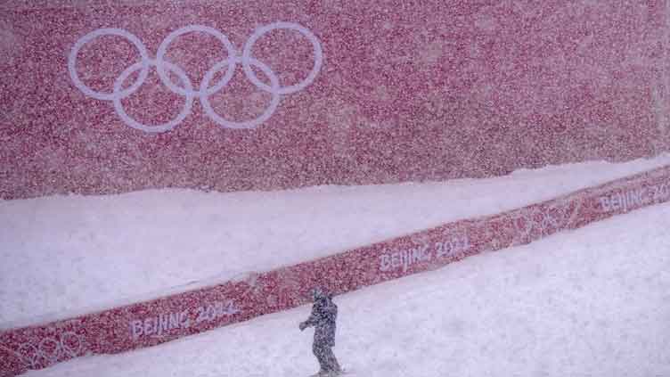 Skiers struggle as real snow falls on Winter Olympics