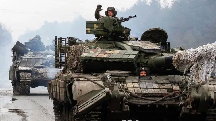 Russian troops ordered to advance in Ukraine as Kyiv imposes blanket curfew 